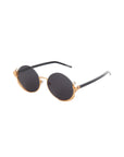The Ariel sunglasses by For Art's Sake® feature round dark lenses, gold metal frames, and sleek black arms, shown on a white background.