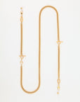 The image shows the For Art's Sake® Lisbon, an 18-karat gold chain necklace featuring a twisted rope design. The statement necklace has two T-bar clasps situated at different points along the chain and a lobster clasp at the end. The Lisbon is laid out in an elongated S-shape against a white background.