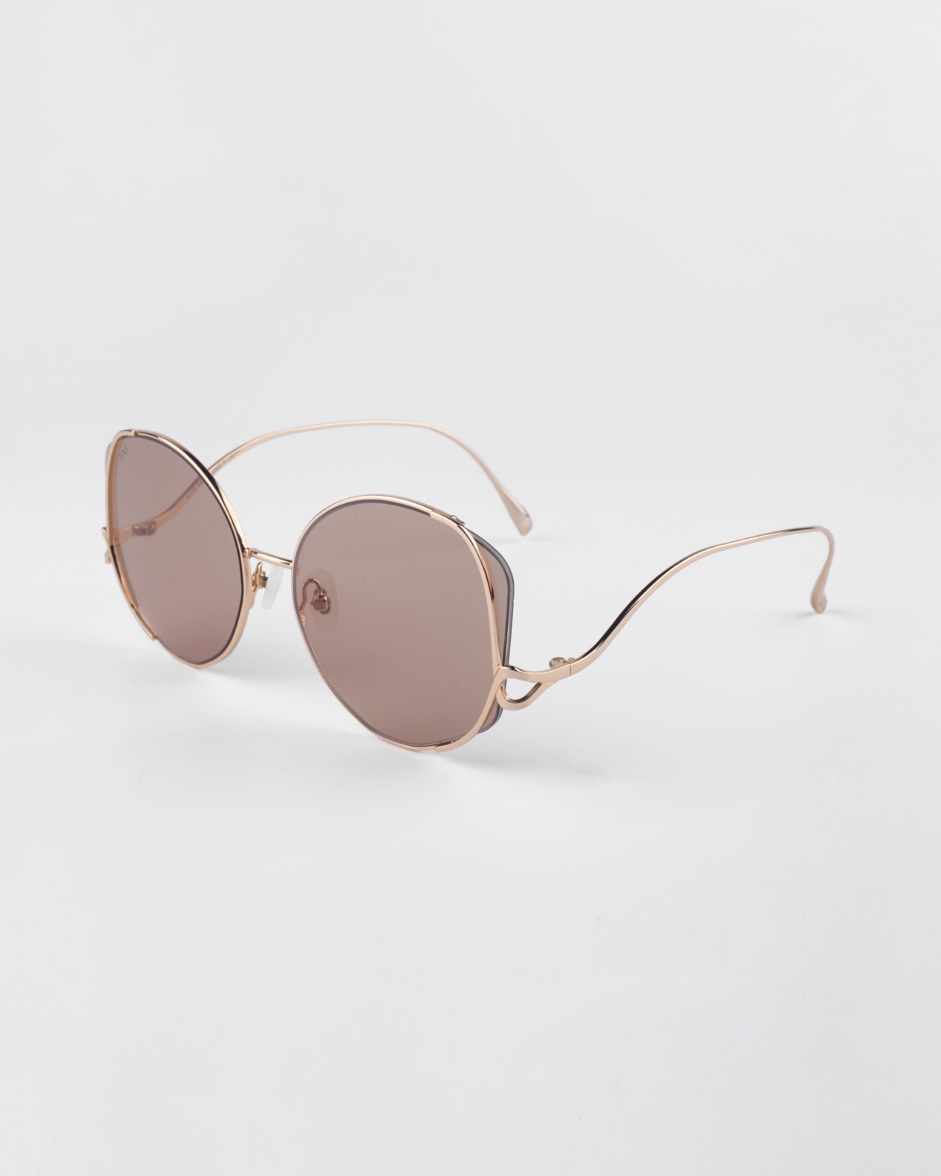 For Art's Sake 'Canvas' sunglasses in sand. A side view image showing the gold frame details with circle shapes.