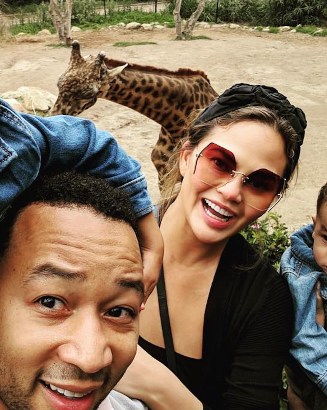 Chrissy Teigen John Legend family day out wearing designer For Art's Sake Generation sunglasses.