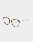 A pair of the Club tortoiseshell cat-eye eyeglasses by For Art's Sake®, featuring gold metal temples, clear lenses, and a Blue Light Filter, is shown against a plain white background.
