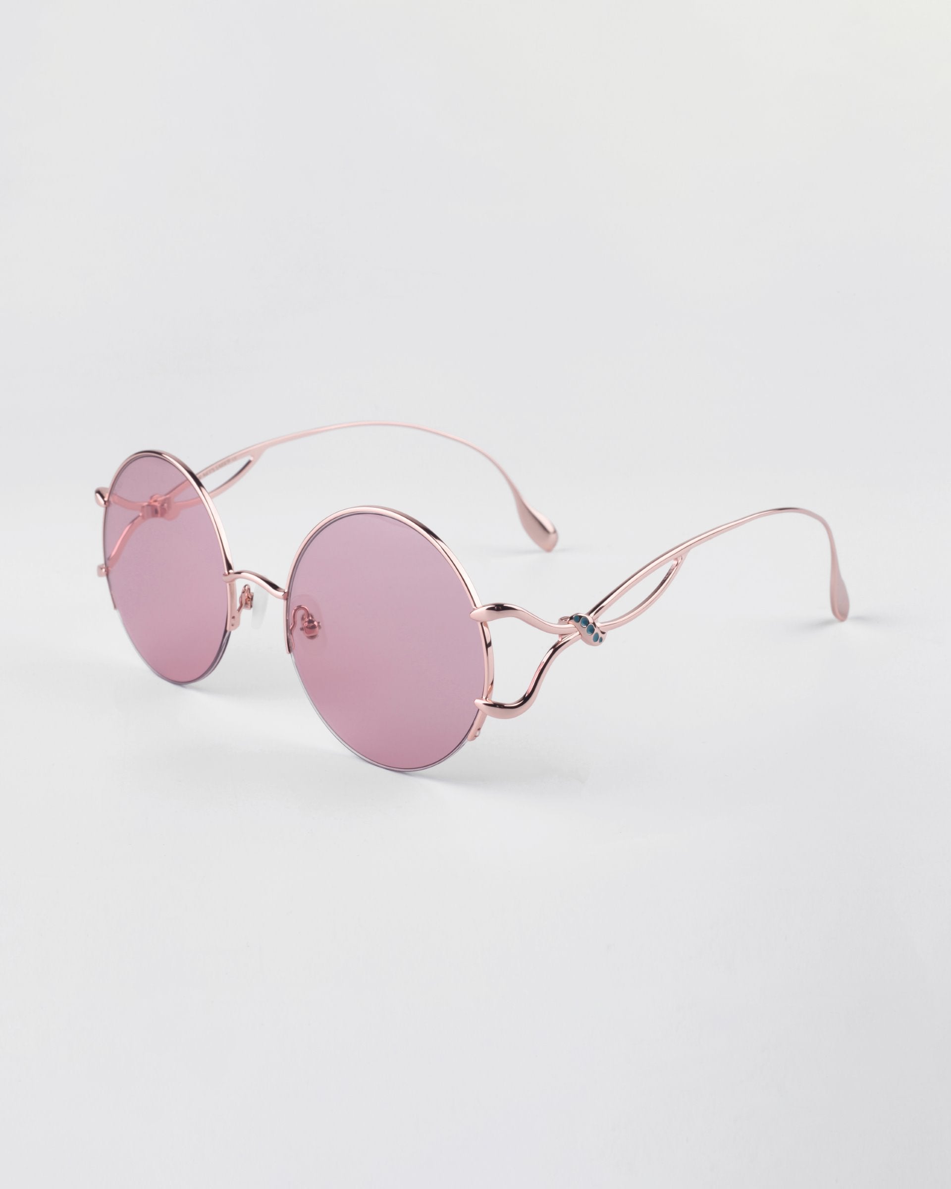 Diptych - Pink sunglasses by For Art's Sake® feature pink-tinted lenses, thin rose gold frames, and comfy jadestone nosepads—all shown on a white background. Only 2 left!.