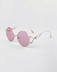 Diptych - Pink sunglasses by For Art's Sake® feature pink-tinted lenses, thin rose gold frames, and comfy jadestone nosepads—all shown on a white background. Only 2 left!.