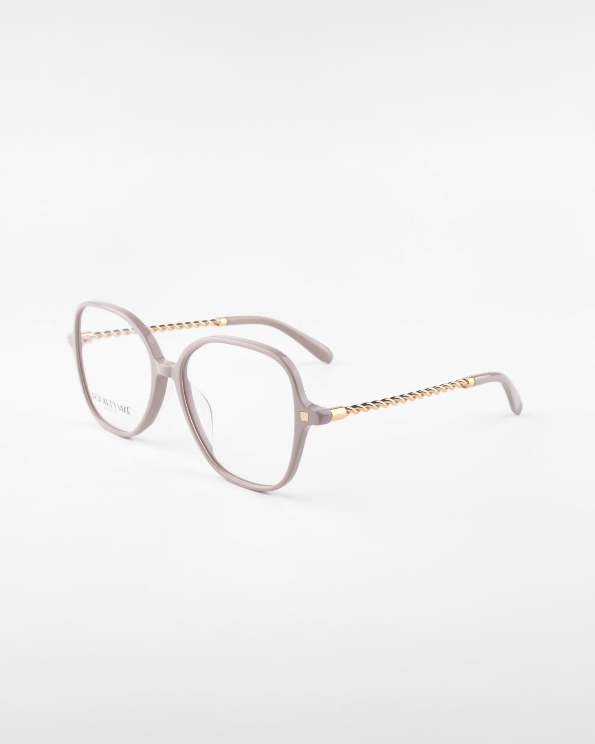 A pair of stylish For Art's Sake® Dumpling eyeglasses with light pink, rectangular frames and gold detailing on the arms. The temples feature a twisted gold design, adding a touch of elegance. Complete with UV Protection, these glasses are perfect for both fashion and function against harmful rays.