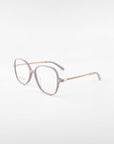 A pair of stylish For Art's Sake® Dumpling eyeglasses with light pink, rectangular frames and gold detailing on the arms. The temples feature a twisted gold design, adding a touch of elegance. Complete with UV Protection, these glasses are perfect for both fashion and function against harmful rays.