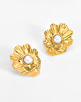 For Art's Sake® The Shell Earrings: Gold, flower-shaped sea shell earrings with a ruffled texture and a central round freshwater pearl—perfect for everyday wear and displayed on a plain white background.