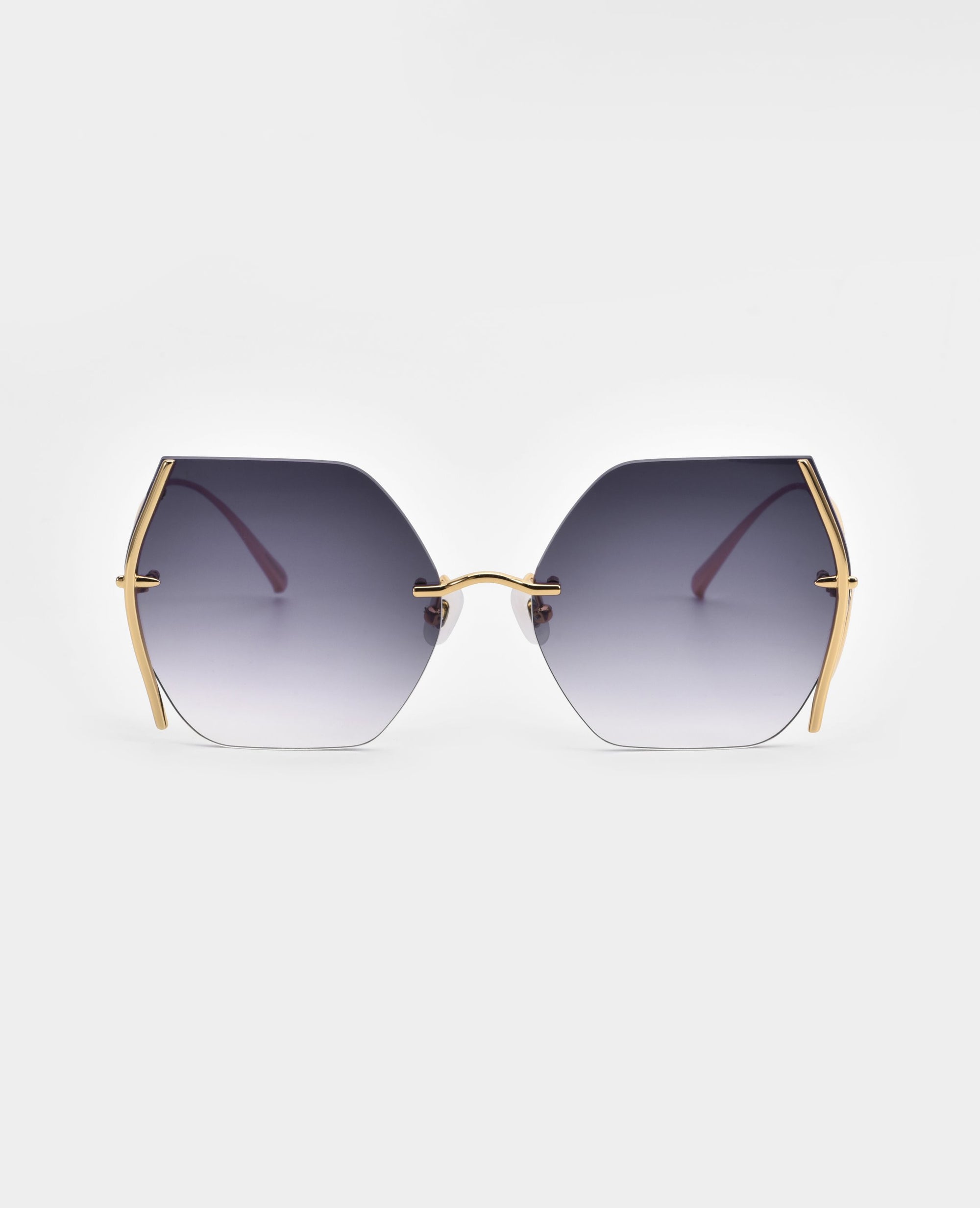 A pair of hexagonal sunglasses with UV protection and gradient lenses that transition from dark to light, set in a gold-plated stainless steel frame with visible jadestone nosepads and temples. The background is plain white, highlighting the sleek, modern design of the Generation sunglasses by For Art's Sake®.