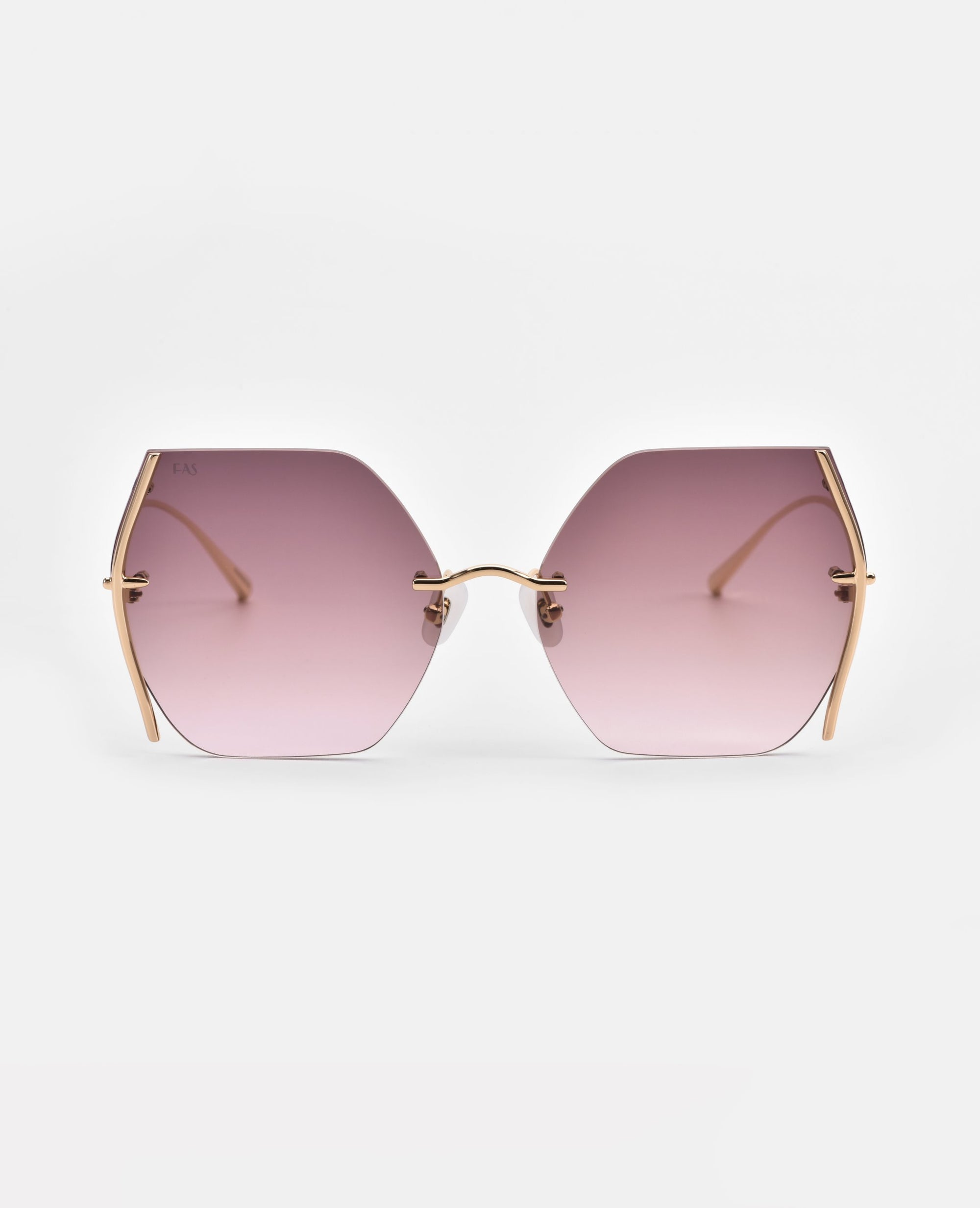 Minimalist Generation sunglasses by For Art's Sake® with large, gradient purple-tinted hexagonal lenses and thin gold-plated stainless steel frames. These stylish sunglasses offer UV protection and have no visible nose pads, providing a modern and sleek design. The background is white, emphasizing the chic eyewear.