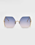 Generation Topaz sunglasses by For Art's Sake® feature hexagonal gold frames and gradient blue-to-clear lenses. ONLY 1 AVAILABLE! A rare find offering UV protection and standout style, displayed on a plain white background.
