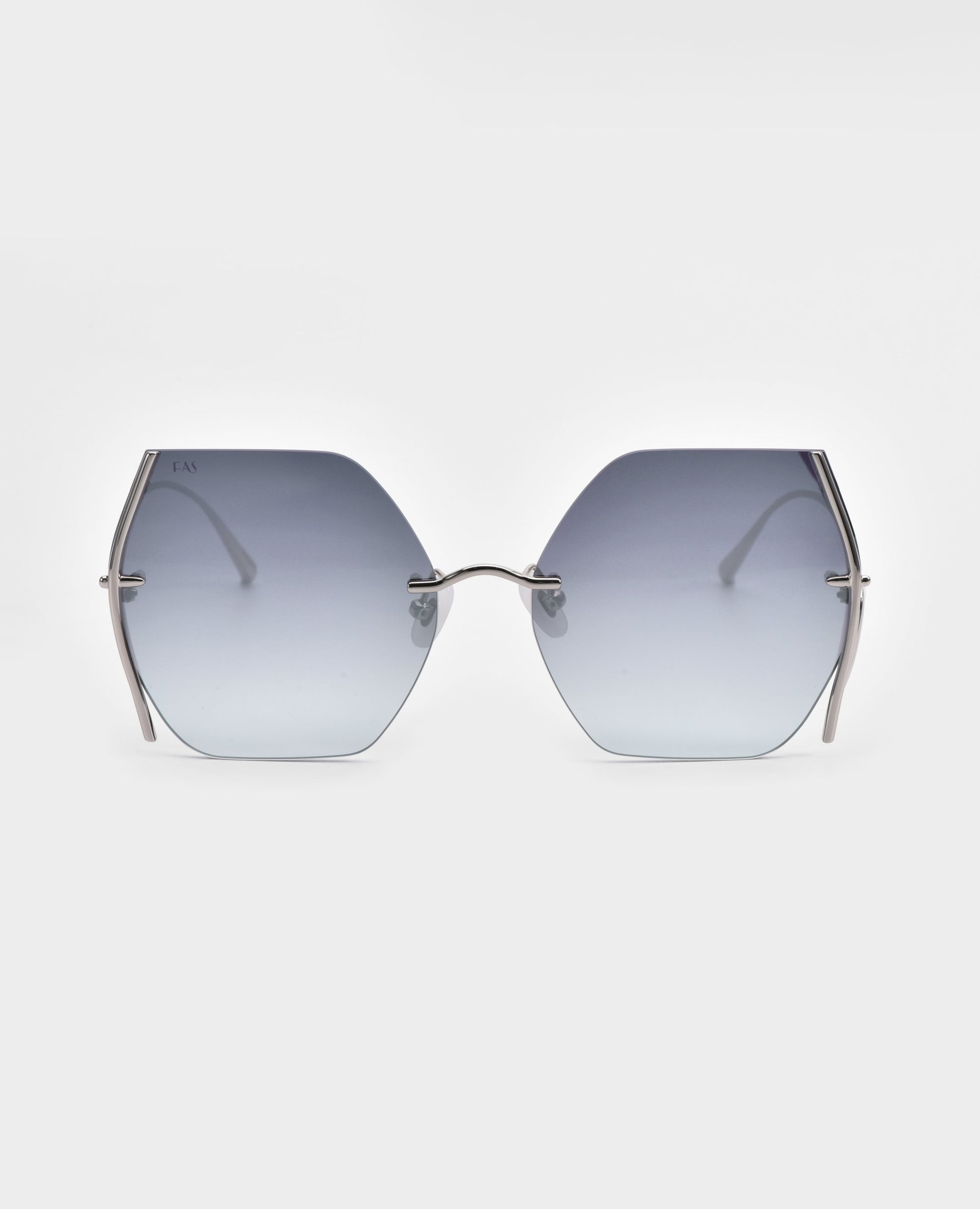 A pair of For Art's Sake® Generation sunglasses with gradient blue lenses is displayed against a plain white background. The sunglasses have thin, metallic silver frames and UV protection. The arms of the glasses are also metallic silver, and they feature subtle jadestone nosepads for added comfort.