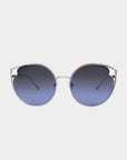 A pair of stylish sunglasses, the Cat by For Art's Sake®, featuring large, round, blue-tinted nylon lenses and a thin metallic frame. The frame has a minimalist design with slight outward flaring at the temples and adjustable nosepads for added comfort. The background is plain and white.