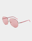 A pair of For Art's Sake® Explorer Pink UV-protected sunglasses with pink-tinted lenses and stylish pink and silver frames. These contemporary aviator shades feature thin, angular metal frames and pink-tipped arms. The background is plain white, highlighting their chic design.