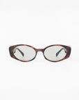 A pair of For Art's Sake® Frida Portrait sunglasses with brown tortoiseshell frames and ultra-lightweight Nylon lenses, offering 100% UVA & UVB protection. The dark-tinted lenses complement the frames and are positioned facing forward against a plain white background.