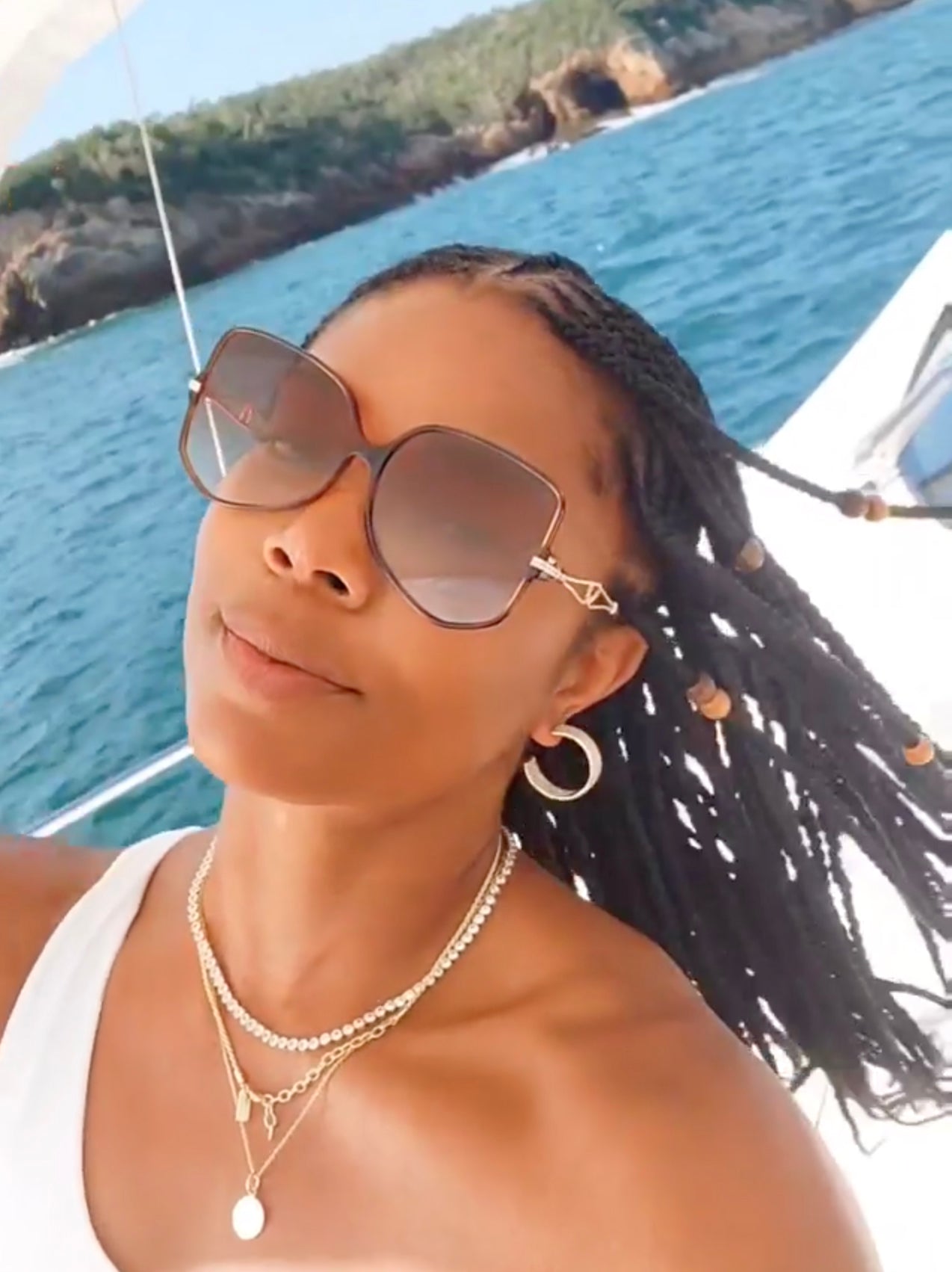 Gabrielle Union wearing designer For Art's Sake Voyager sunglasses on vacation.
