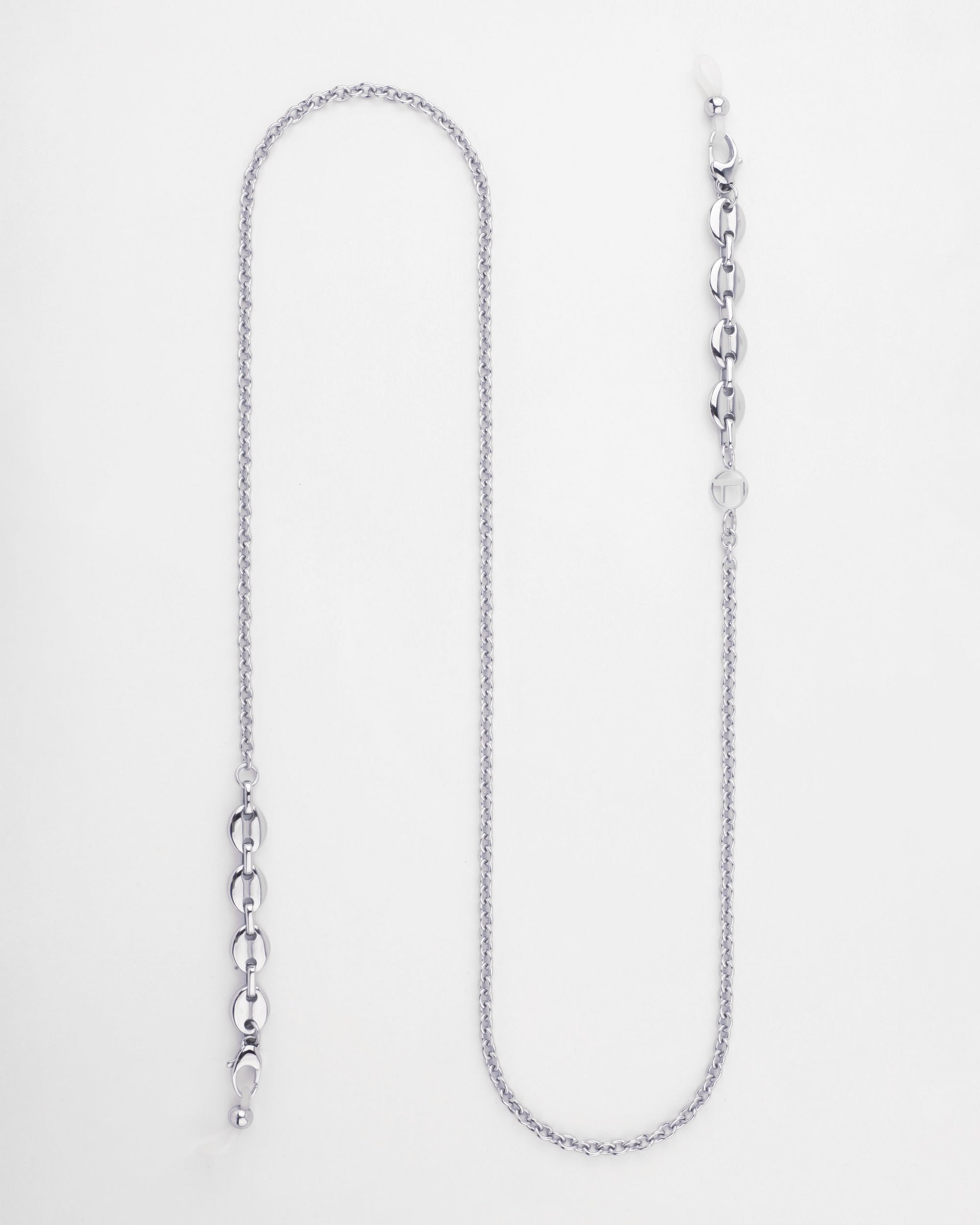 A contemporary eyewear chain featuring a mix of chunky round links and smaller, delicate links in an 18kt gold-plated finish. The accessories end in adjustable loops for attaching to eyeglasses. This stylish piece also incorporates freshwater pearls, adding elegance against a plain white background. This is the Hackney Glasses Chain by For Art's Sake®.