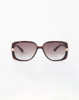 The Icon-ARC shades by For Art's Sake® feature D-frame tortoiseshell frames with dark gradient lenses for UVA/UVB protection. Gold-accented temples near the hinges add style and elegance against a plain white background.
