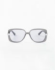 Front view of Icon- ARC, a pair of handcrafted sunglasses by For Art's Sake®, showcasing square gray acetate frames and dark lenses with UVA & UVB protection against a plain white background.