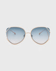 The Wonderland sunglasses by For Art's Sake® feature gold metal frames, jadestone nose pads, and large blue gradient lenses with 100% UV protection, shown against a white background.