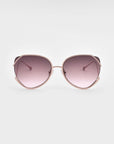 The Wonderland oversized sunglasses by For Art's Sake® feature pink-tinted gradient lenses, thin light pink metal frames, jadestone nose pads, and 100% UV protection, shown against a plain white background.