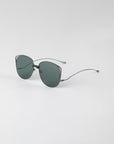 A pair of stylish Spacie sunglasses from For Art's Sake®, featuring dark-lensed, softly rounded square lenses, a sleek metallic frame with 18-karat gold plating, and thin curved arms, resting on a plain white surface. This elegant design also includes unique jadestone nosepads.