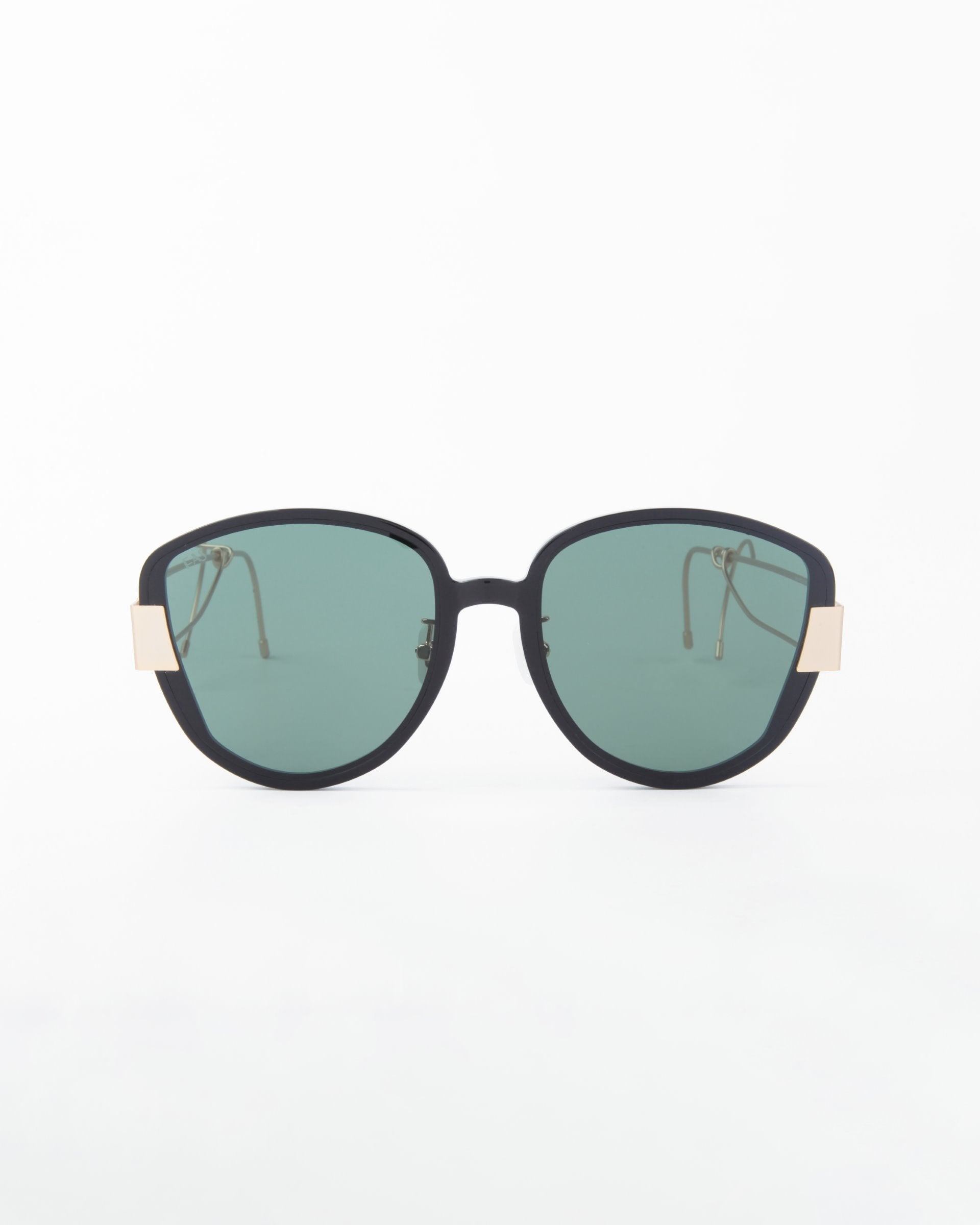 A pair of stylish black Mars sunglasses by For Art's Sake®, with large, round, shatter-resistant nylon lenses and gold-plated stainless steel accents on the sides of the frame. The green-tinted lenses offer UVA & UVB protection. The background is plain white.