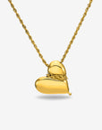 The Puffy Heart Bracelet by For Art's Sake® features a shiny, smooth, heart-shaped gold charm on a twisted chain, displayed against a plain white background.