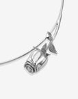 The Rose Choker by For Art's Sake® is a modern necklace featuring a sculpted rose pendant with two leaves, shown in close-up against a plain white background.