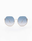 Front view of Palace sunglasses by For Art's Sake® with gradient blue lenses and thin 18-karat gold-plated frames. The arms of the sunglasses are also gold, with white earpieces. These UVA & UVB-protected sunglasses are Limited Edition. The image has a clean white background.