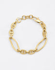 A delicate, 24k gold plated bracelet featuring an alternating pattern of oval and elongated link chains. It has a polished finish and a lobster clasp closure. This elegant Portrait Bracelet Gold by For Art's Sake® boasts a minimalist design against a plain white background and is hypoallergenic for sensitive skin.