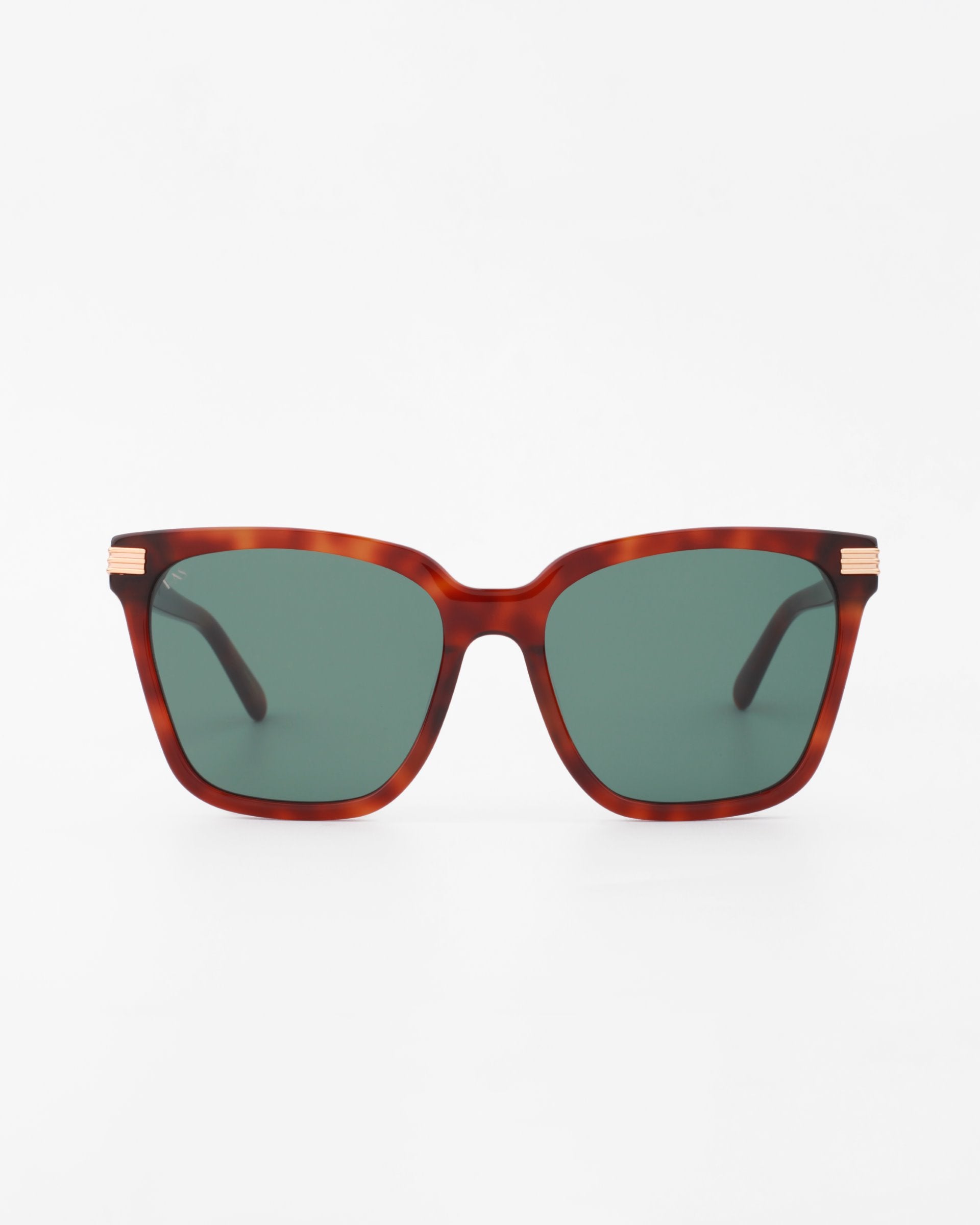 A pair of Gaia sunglasses by For Art's Sake® featuring square-shaped, handmade acetate frames with dark green UV-protected lenses and brown tortoiseshell accents. The black arms showcase small 18-karat gold-plated details at the temples against a plain white background.