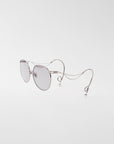 For Art's Sake® Birthday Cake-Blue sunglasses feature round silver frames, distinctively curved wire arms with small loops and faux pearl earrings, displayed on a plain white background.