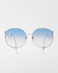 The For Art's Sake® Birthday Cake-Blue sunglasses feature silver metal frames, blue gradient lenses, and faux pearl earring-inspired beads dangling from the earpieces, shown against a neutral white background.