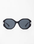 A pair of large, black Seaside sunglasses by For Art's Sake® with shatter-resistant lenses. The frames are thick and oversized, handmade from acetate for a bold look. Gold-plated temple detailing accents the hinges on both sides. The background is plain and white.