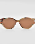 The For Art's Sake® Vincent Van Gogh cat-eye sunglasses feature warm brown-tinted lenses and a marbled frame in beige, brown, and green—perfect for unique collectible eyewear, shown on a plain white background.