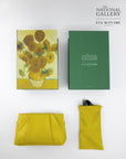 A flat lay shows the For Art’s Sake® Vincent Van Gogh (Limited Edition) sunglasses in a yellow pouch, with branded boxes and a yellow clutch, all against a white background featuring National Gallery branding.