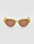 The Vincent Van Gogh by For Art's Sake® features collectible eyewear with thick light yellow frames and brown tinted lenses, shown against a plain light gray background.