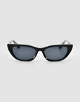 The Claude Monet limited edition cat-eye sunglasses by For Art's Sake® feature a black frame and dark tinted lenses, displayed from the front against a plain light gray background.
