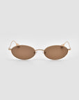For Art's Sake® Calla I: lightweight, modern oval metal glasses with thin gold frames and brown tinted lenses, showcased on a plain light grey background.