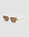For Art's Sake® Florist sunglasses feature a brown rectangular frameless design, gold-toned temples, and floral accents at the hinges, displayed on a light gray background.