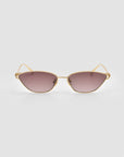 The Tulip II by For Art's Sake® features gold cat-eye frames, gradient brown lenses, and a subtle tulip detail, shown on a plain light gray background.