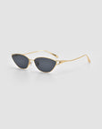 For Art's Sake® Tulip II sunglasses feature gold metal frames, sculpted tulip details, and dark oval lenses, shown on a plain light gray background.