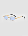 The For Art's Sake® Mesa I features gold-framed rectangular eyeglasses with light blue lenses and black temple tips, exuding quiet luxury against a plain light gray background.