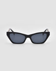 For Art's Sake® Mesa II: black sculptural cat-eye sunglasses with dark lenses, shown on a plain light gray background.