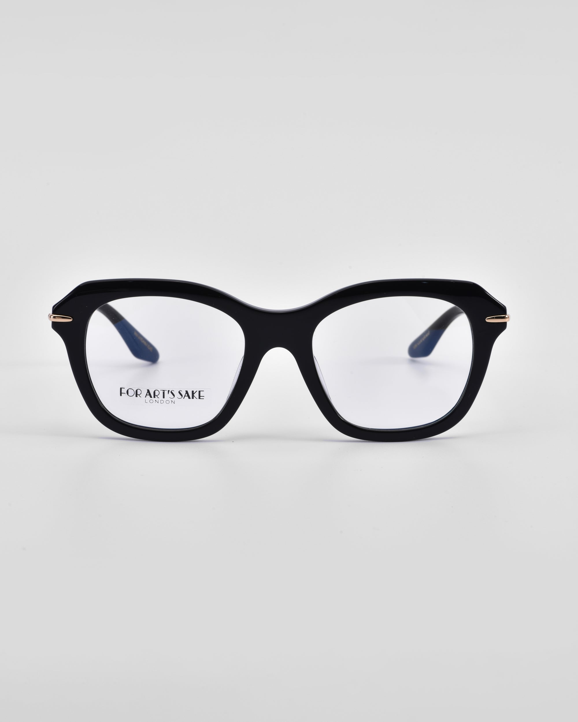 Black rectangular eyeglasses with 18-karat gold plating on the temples. The product name "Helene" and brand name "For Art's Sake®" are visible on the left lens. The glasses are set against a plain white background.