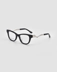 For Art’s Sake® Poppy eyeglasses feature rectangular black frames and sculptural metal temples with bold silver zigzag arms and black tips, showcased on a plain light gray background.