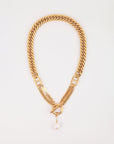 A Girlfriend Necklace by For Art's Sake®, featuring a gold-plated stainless steel necklace with a toggle clasp and a single freshwater pearl charm hanging from the center. The chunky flat-curb chain features interlocking links and a stylish, elegant design. The background is plain and white.