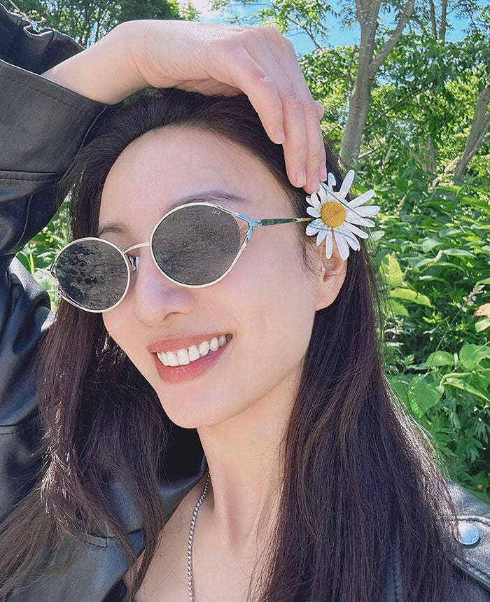 Chinese singer Yumiko Cheng wearing designer For Art's Sake Sky sunglasses.