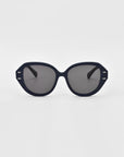 The For Art's Sake® Mirage White sunglasses feature cat-eye frames with dark lenses and thick rims, showcased from the front against a plain white background.