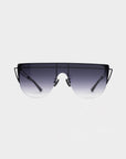 Introducing Alien by For Art's Sake®: stylish, oversized sunglasses featuring a sleek black metal frame and offering UV protection. The gradient lenses transition from dark at the top to light at the bottom, while thin, elegant arms accentuate the modern design of this handcrafted eyewear against a plain white background.