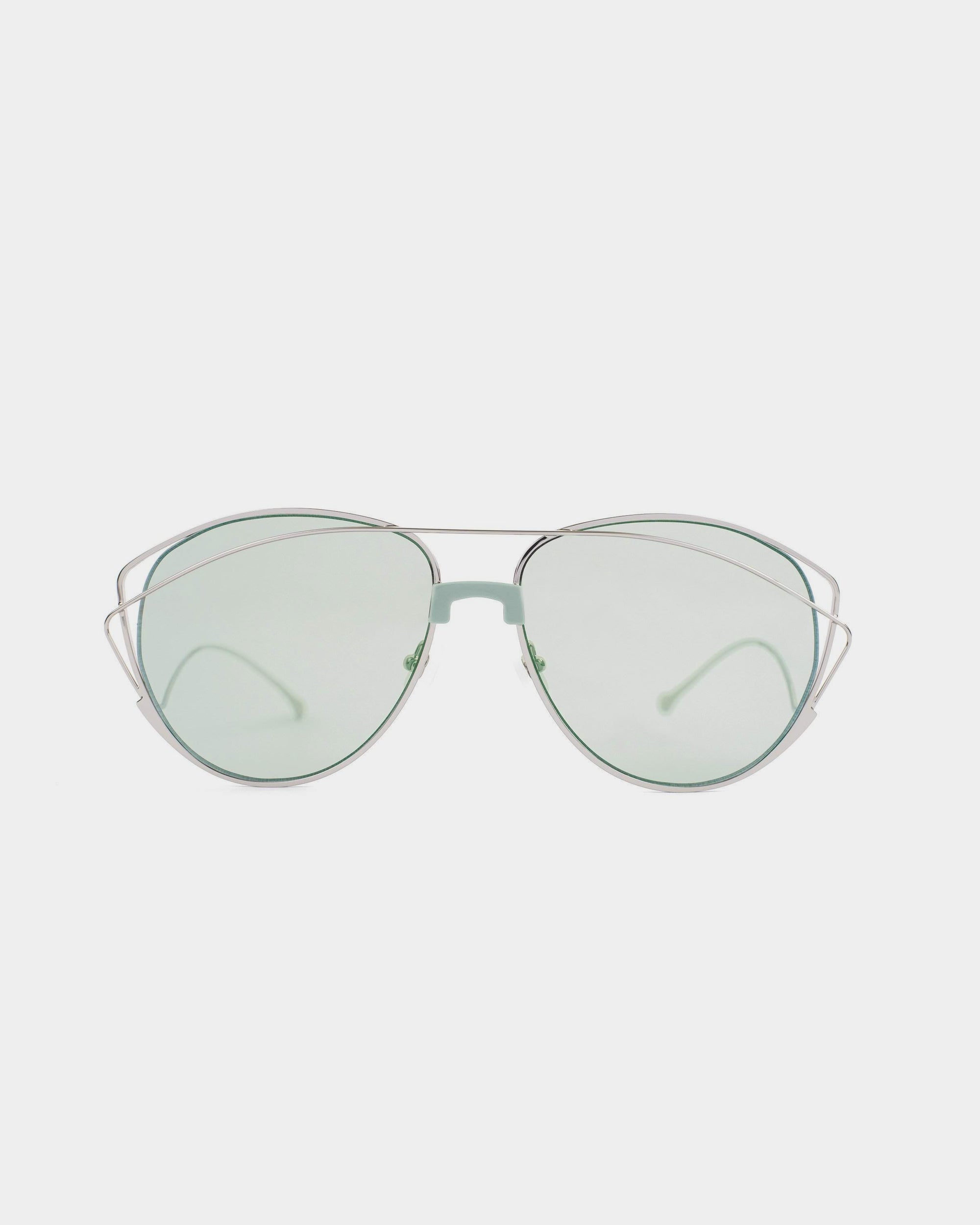 Introducing the Dark Eyes sunglasses by For Art's Sake®, featuring 100% UV protection with light green-tinted nylon lenses. These stylish sunglasses boast a unique double metal frame design, with the upper frame in silver stainless steel and the bottom frame in medium green. The white background accentuates their striking appearance.
